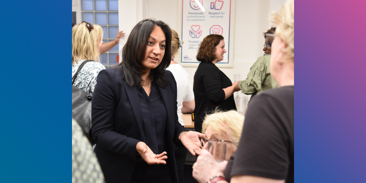 ISHA board member Yasmin speaking with residents.