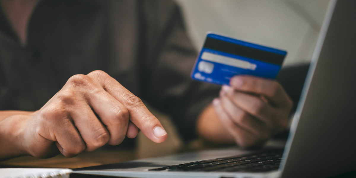 A person making a card payment online using a laptop.