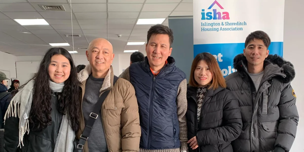 Chuong (an Outreach and Support Officer) with ISHA residents at a 2025 Lunar New Year (Tết) celebration.