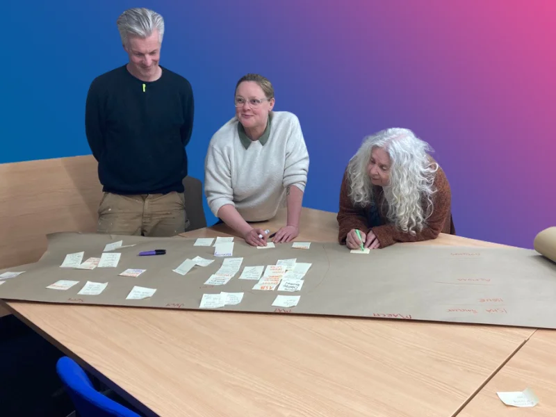 Members of the panel in a planning meeting.