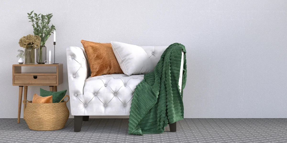A small sofa, side table and other personal items.